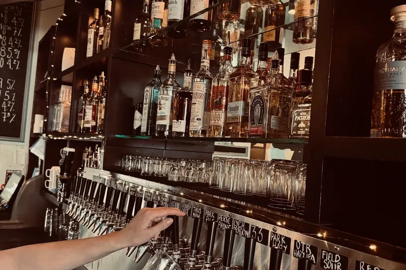 Beer taps and bottles behind the bar at Barney’s on Main.
