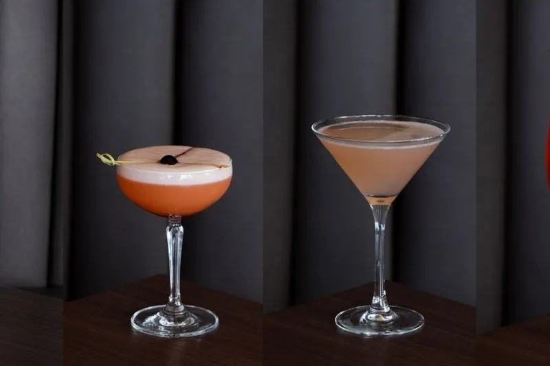 Two cocktails served on a table at Bayside Lounge.