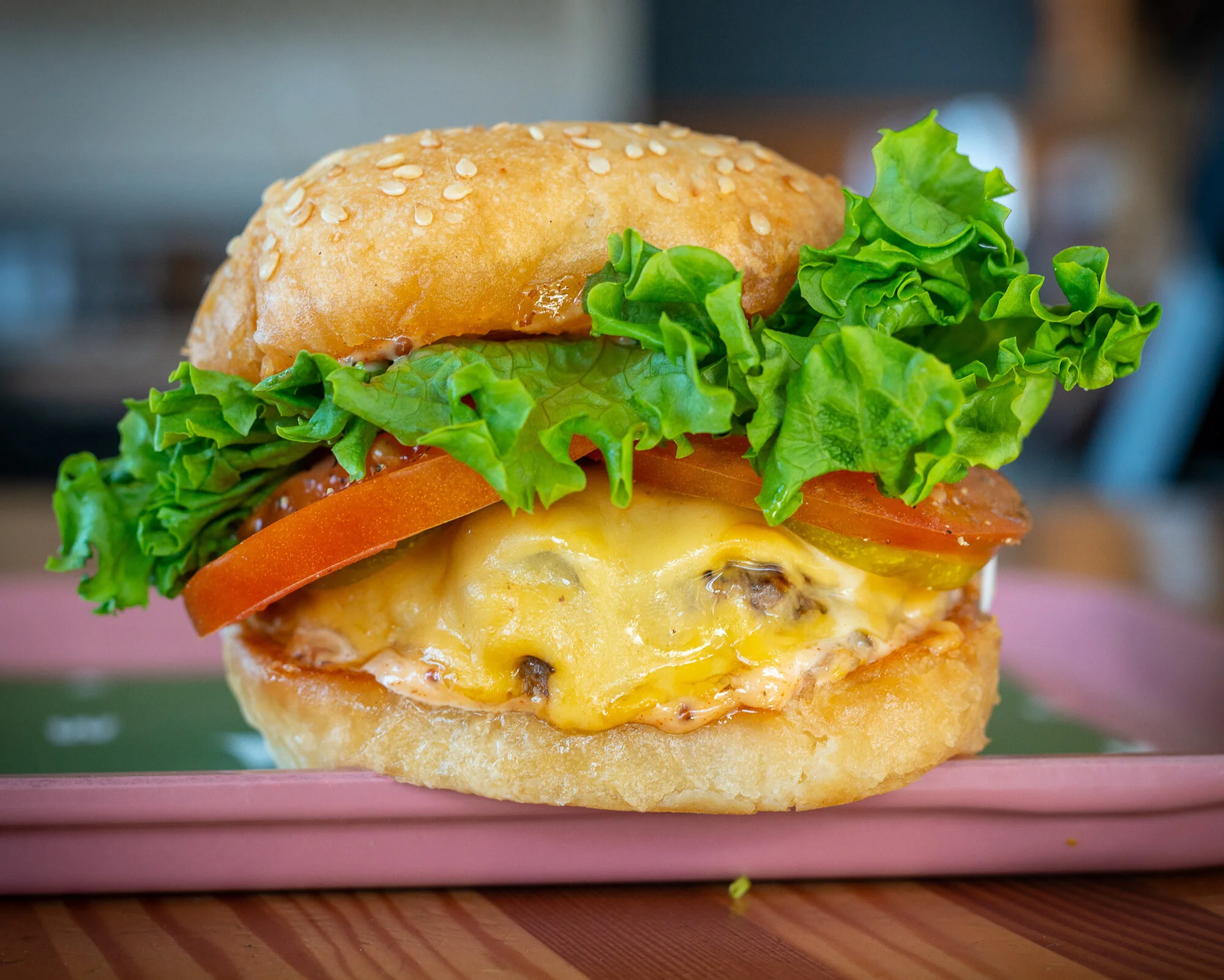 Cheeseburger with lettuce and tomato at Bells and Whistles.