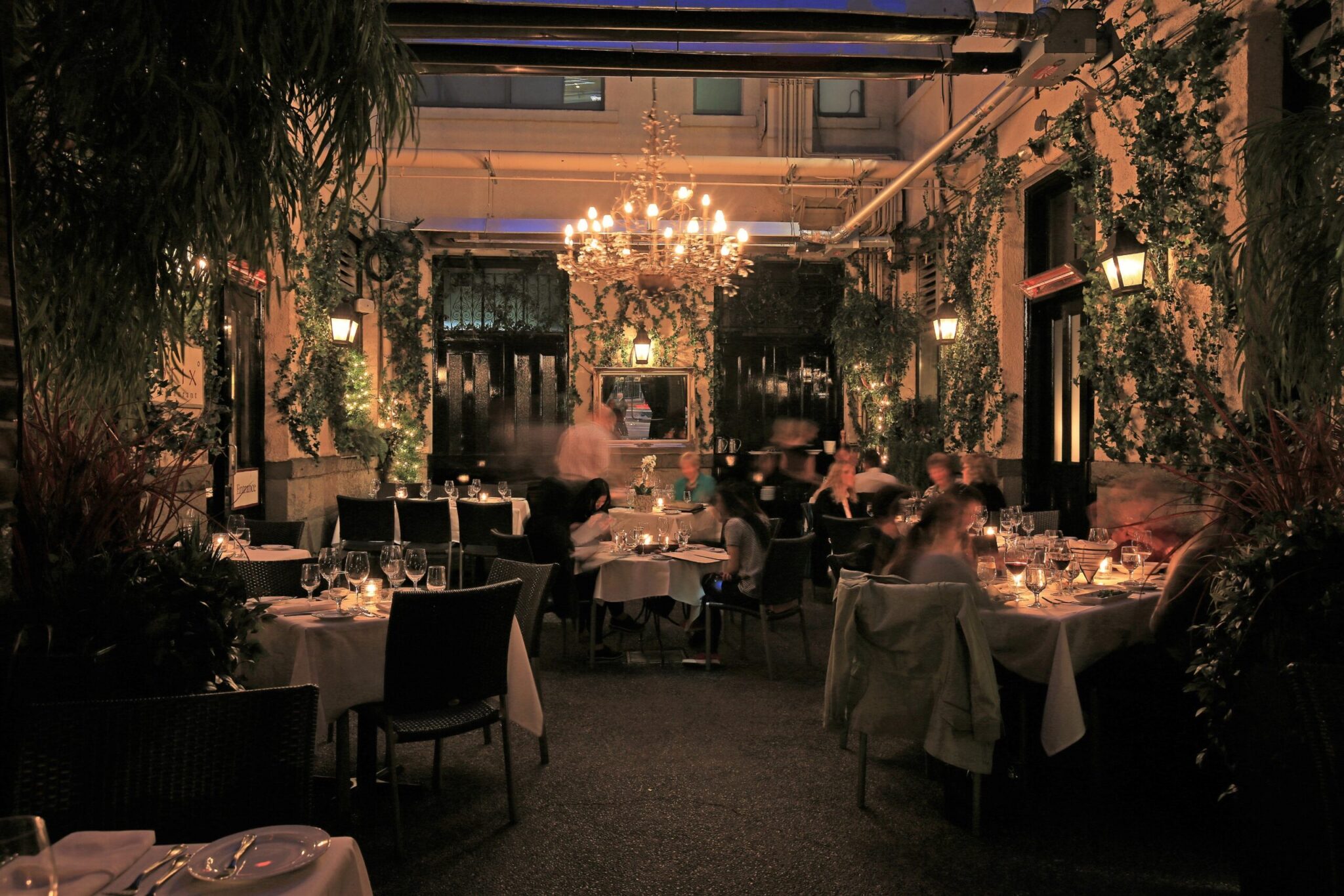 Chandelier-lit courtyard dining room at Brix and Mortar.