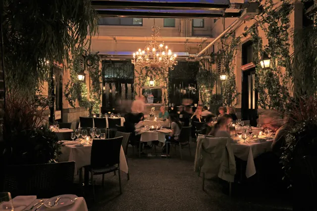 Chandelier-lit courtyard dining room at Brix and Mortar.