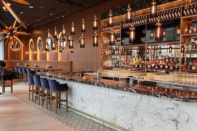 Stools beside the marble bar at Chop Steakhouse in Coal Harbour.