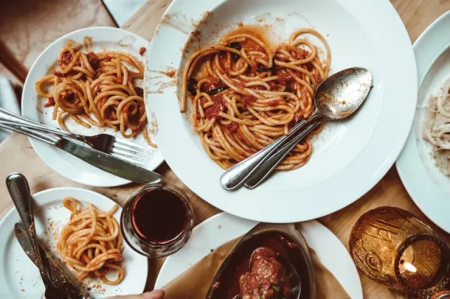 Plates of pasta served on a table at Di Beppe.