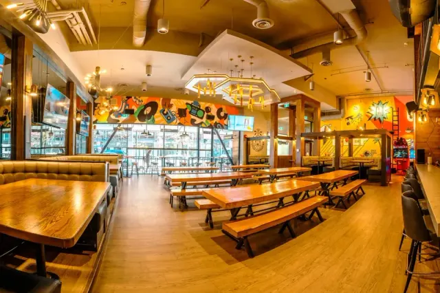 Long tables and benches inside Good Co Granville.