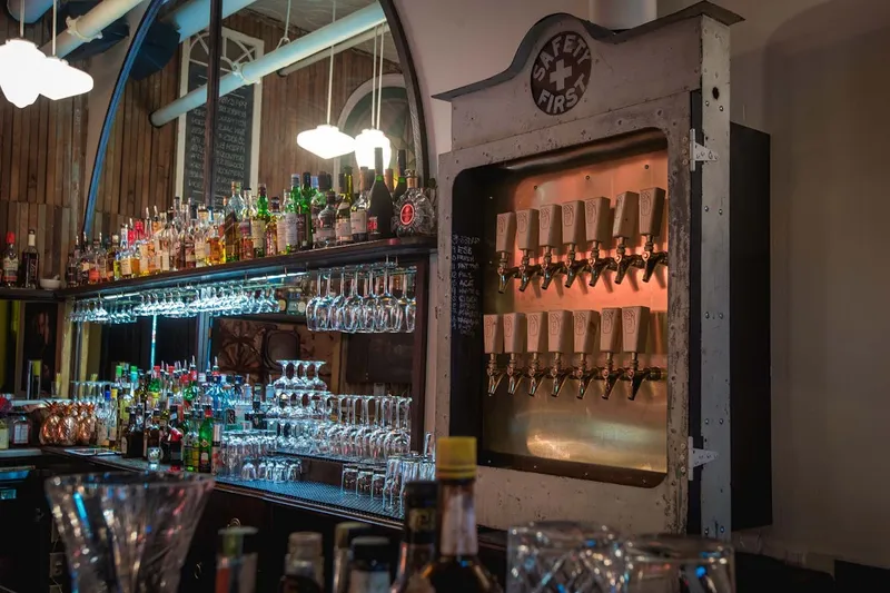 Bottles and taps behind the bar at Clough Club.