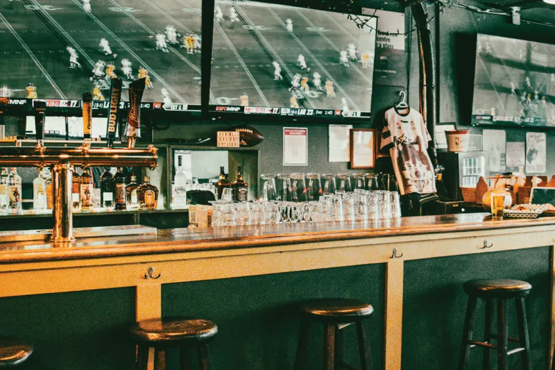 Beer taps, stools and television screens at Dublin Calling Vancouver.