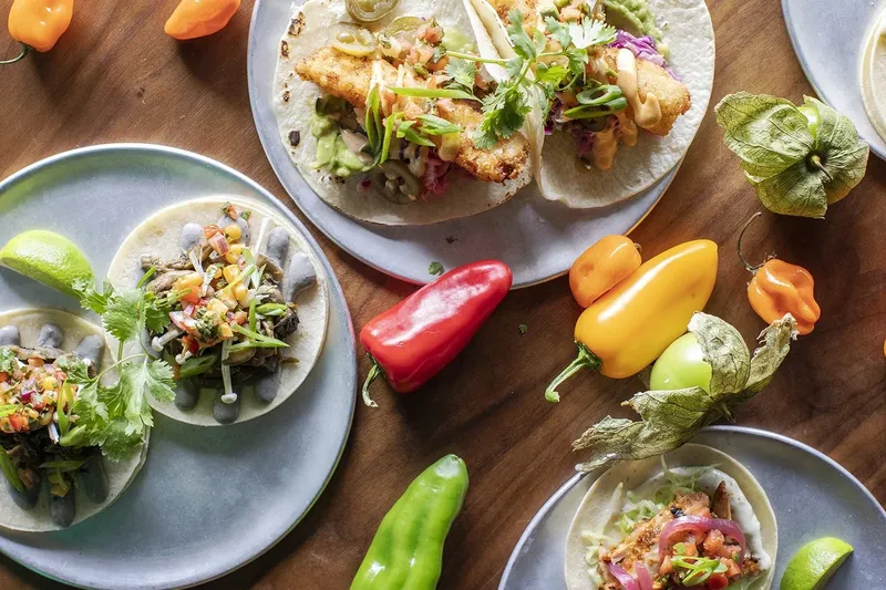 Tacos, citrus and peppers arranged on a table at El Camino’s.