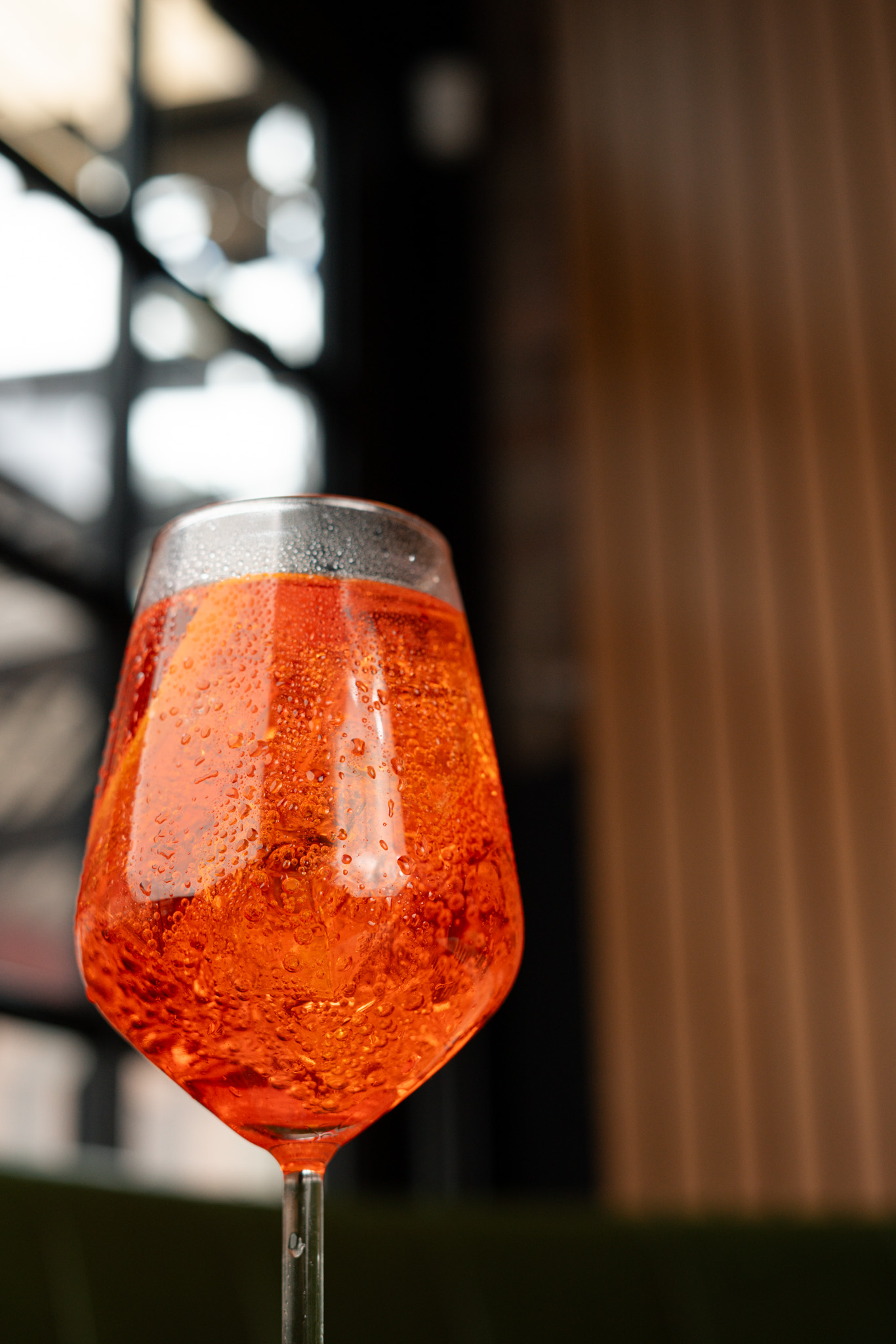 A chilled orange cocktail pictured on Ray's official website.