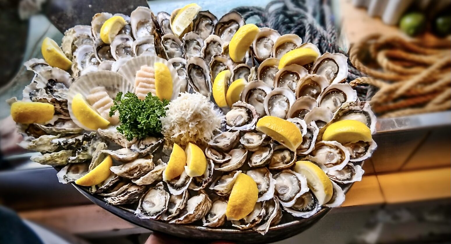 An oyster and shellfish platter with lemon wedges from Rodney's Oyster House Yaletown.